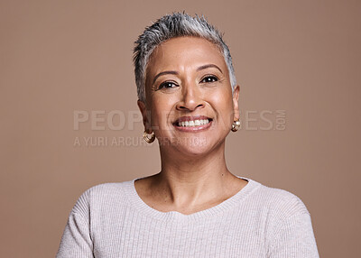 Buy stock photo Face, beauty and portrait of a senior woman with a smile standing with natural makeup in studio. Wellness, cosmetics and happy elderly lady with healthy skin posing while isolated by brown background