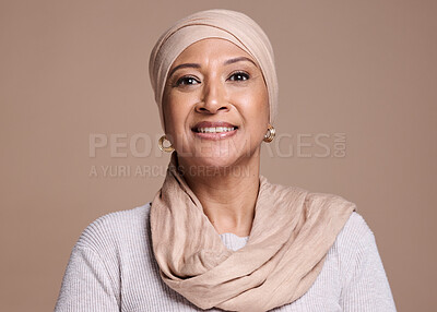 Buy stock photo Muslim, hijab and arab ,woman in studio for beauty, religion and happiness for cosmetics, makeup and fashion on a brown background. Face portrait of a female with a smile for skincare with a glow