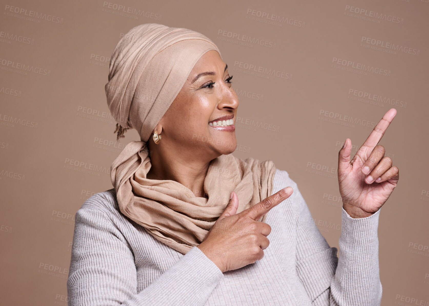 Buy stock photo Mature islam woman, pointing or advertising mock up, marketing space or studio background mockup. Happy smile, muslim model or fashion hijab scarf in promotion deal or product placement hand gesture