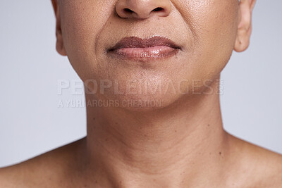 Buy stock photo Beauty, skincare and lips of senior woman isolated in studio for wellness, healthy and natural skin. Makeup, cosmetic and face closeup of black woman for anti aging beauty products on gray background