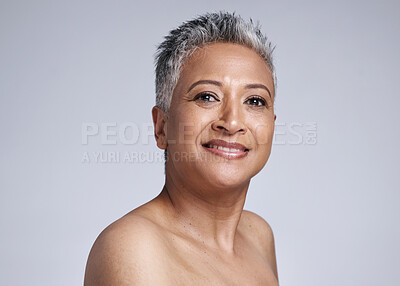 Buy stock photo Portrait, cosmetics and senior woman for wellness, natural beauty and skincare for smooth skin against grey studio background. Makeup, elderly lady and mature female with smile, confident and health.