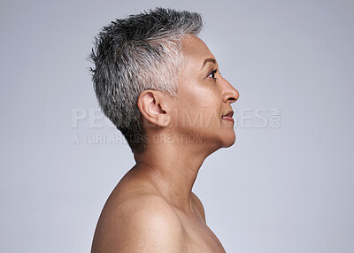 Mature woman, face and skincare glow on gray studio background in plastic surgery, body dermatology or cosmetology preparation. Indian beauty model, grey hair or makeup cosmetics on mock up backdrop