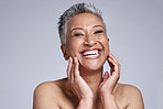 Elderly woman, smile and hands excited for beauty skincare or anti aging wellness in studio. Portrait of mature person, facial care and cosmetics makeup for natural skin glow against grey background