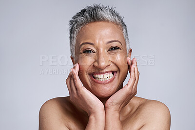 Buy stock photo Beauty, skincare and portrait of senior woman in studio on gray background. Makeup cosmetics, smile and happy mature female model from India touching face for facial or healthy skin treatment routine