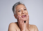 Beauty, senior and comic portrait of woman for cosmetic wellness, health and antiaging marketing. Funny, crazy and excited face of mature skincare model with tongue out for white studio mockup.

