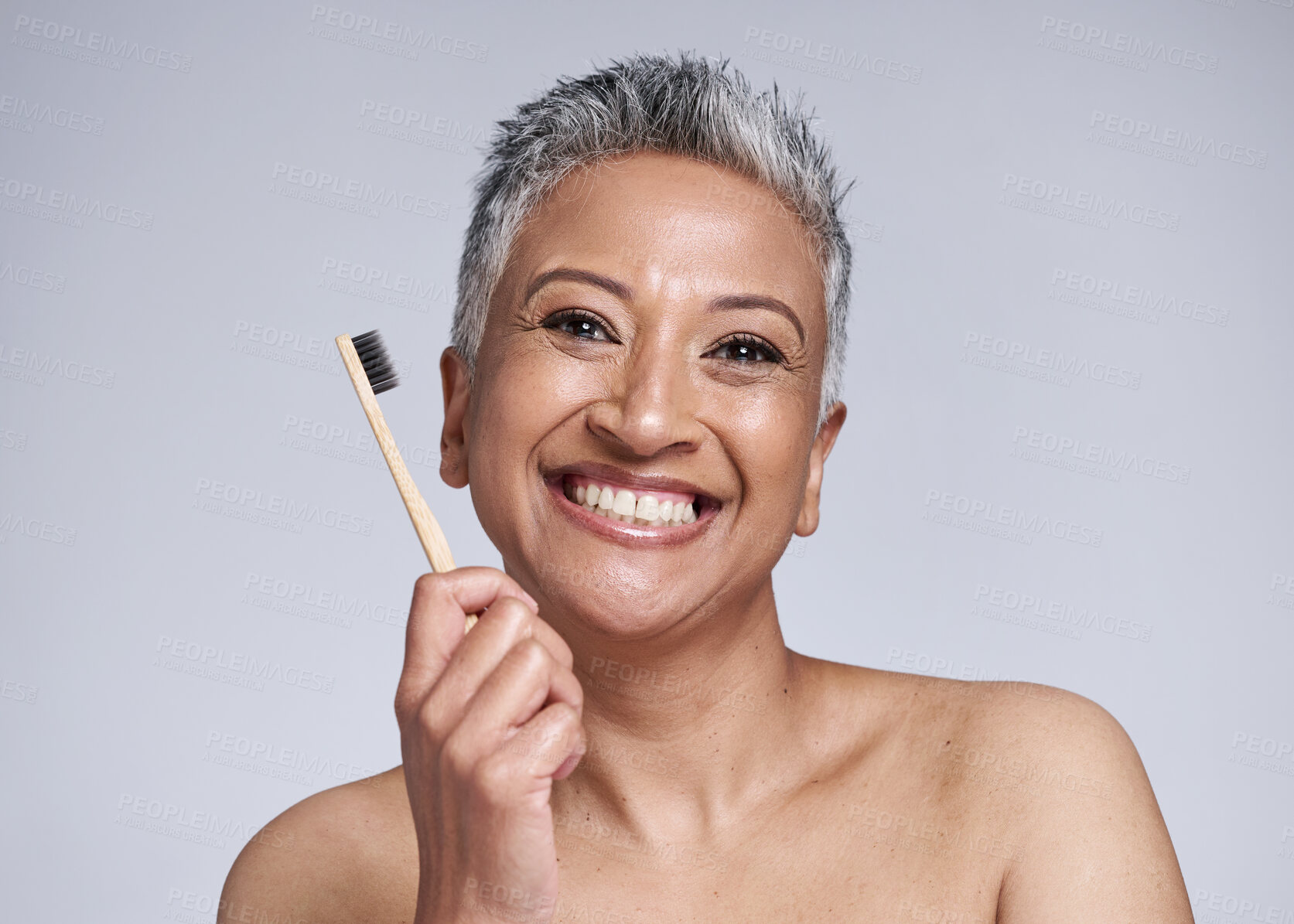 Buy stock photo Dental, woman with toothbrush for hygiene with smile and grooming portrait, oral health and clean against studio background. Mature, dental care and whitening, fresh breath and healthy teeth mockup.