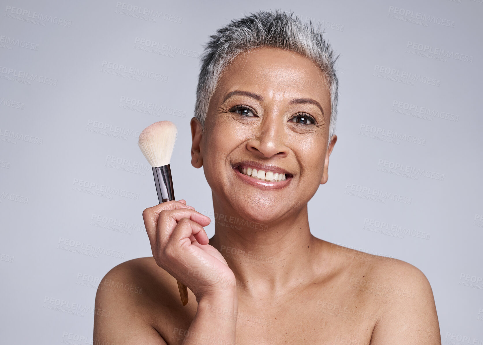 Buy stock photo Beauty, makeup and brush with senior woman for wellness, product and salon cosmetics. Foundation, self care and luxury with smile portrait of face of mature model for health, cosmetology and skincare