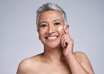 Buy stock photo Skincare, cream and senior woman in studio portrait for beauty, healthy glow and cosmetics with mock up for advertising, promotion and marketing. Happy old woman with sunscreen or antiaging product