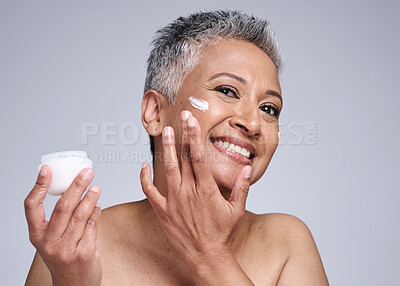 Buy stock photo Mature woman, skincare cream and portrait, sunscreen makeup product and luxury beauty for wellness on studio background. Happy lady face cream, facial spf lotion and natural cosmetics for body care 