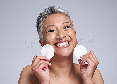 Buy stock photo Skincare, portrait and senior woman with cotton pad for natural, anti aging and beauty routine. Cosmetic, health and face of happy elderly lady with skin treatment isolated by gray studio background.