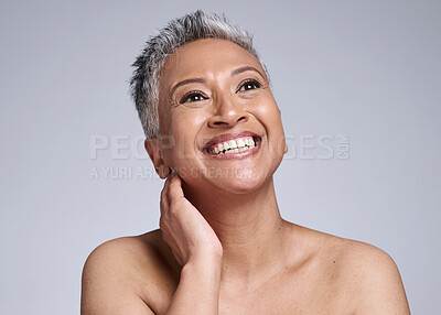 Buy stock photo Face, beauty and antiaging with a senior woman in studio on a gray background to promote natural skincare. Wellness, luxury and cosmetics with a mature female posing for dermatology skin treatment