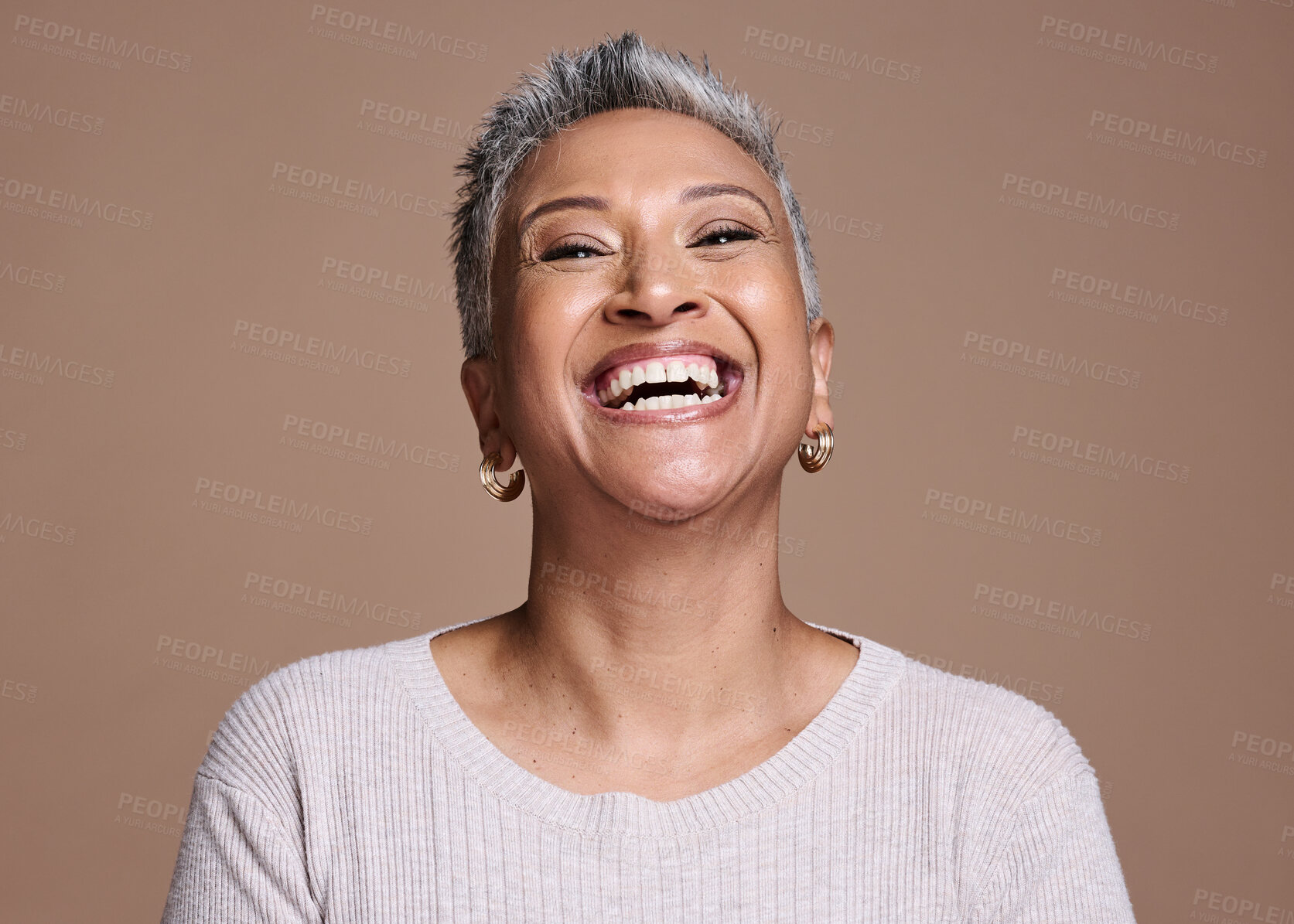 Buy stock photo Black woman, beauty and happiness with a senior laughing about funny joke or memory on a brown studio background. Face portrait of a mature model posing for cosmetics, makeup or fashion mockup