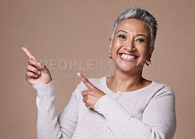 Buy stock photo Skincare, beauty and senior woman pointing in studio mock up for marketing, promotion and advertising of cosmetics, makeup or pension discount. Happy, excited old woman show space mockup for branding