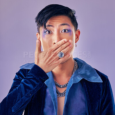 Buy stock photo Surprised, shocked and gay man with makeup in a studio for pride, beauty and gender fluid cosmetics. Lgbtq, queer and homosexual guy with wow, surprise or omg expression isolated by purple background