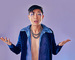 Shock, surprise and gay man with makeup in studio isolated on a purple background. Cosmetics, cyberpunk and lgbtq, queer and punk male model from Japan with omg, wow or shocked facial expression.


