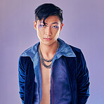Art, purple and creative portrait of man with makeup, serious face and self expression. Futuristic disco funk style fashion, male model from Japan and artistic future beauty on studio background.