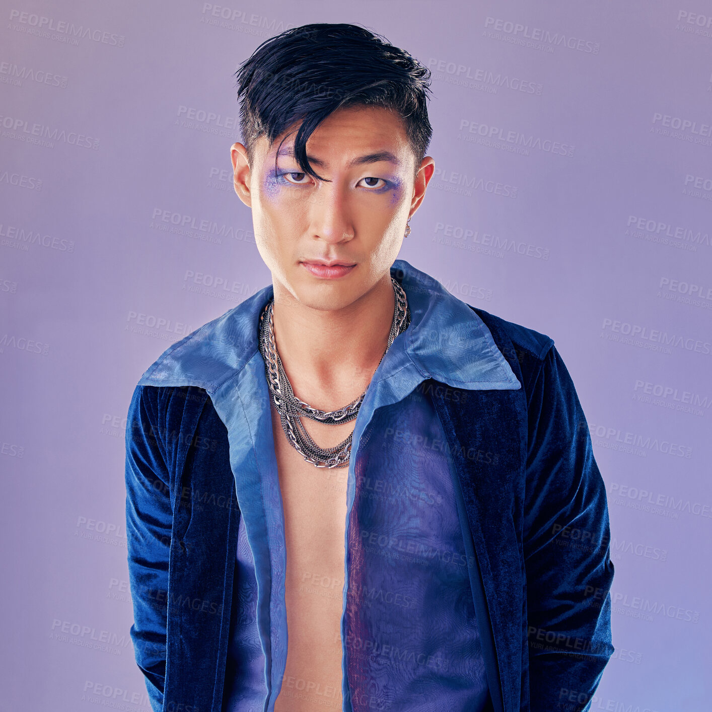 Buy stock photo Art, purple and creative portrait of man with makeup, serious face and self expression. Futuristic disco funk style fashion, male model from Japan and artistic future beauty on studio background.