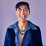 Fashion, purple and crazy punk model with creative eyeliner, makeup design or facial cosmetics for beauty aesthetics. Portrait, creativity and retro Asian man with vintage clothes, energy and style