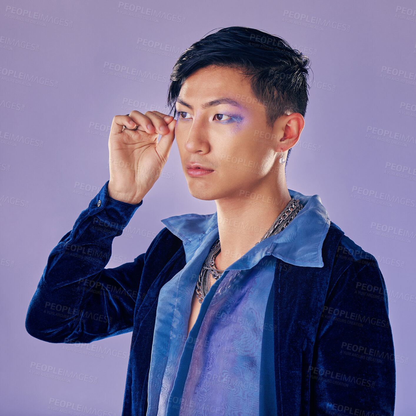 Buy stock photo Punk, rock or gay man with eyeshadow, makeup and cosmetics, vintage or retro fashion clothes on a purple background for pop art style. Asian lgbtq identity model in studio for creative color mockup
