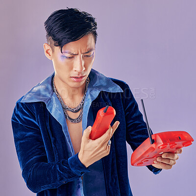 Buy stock photo Purple fashion, telephone and model confused with retro and vintage 1980s telecom device or phone call decline. Punk glitter design, eyeshadow sparkle and creative asian man with gen z beauty makeup