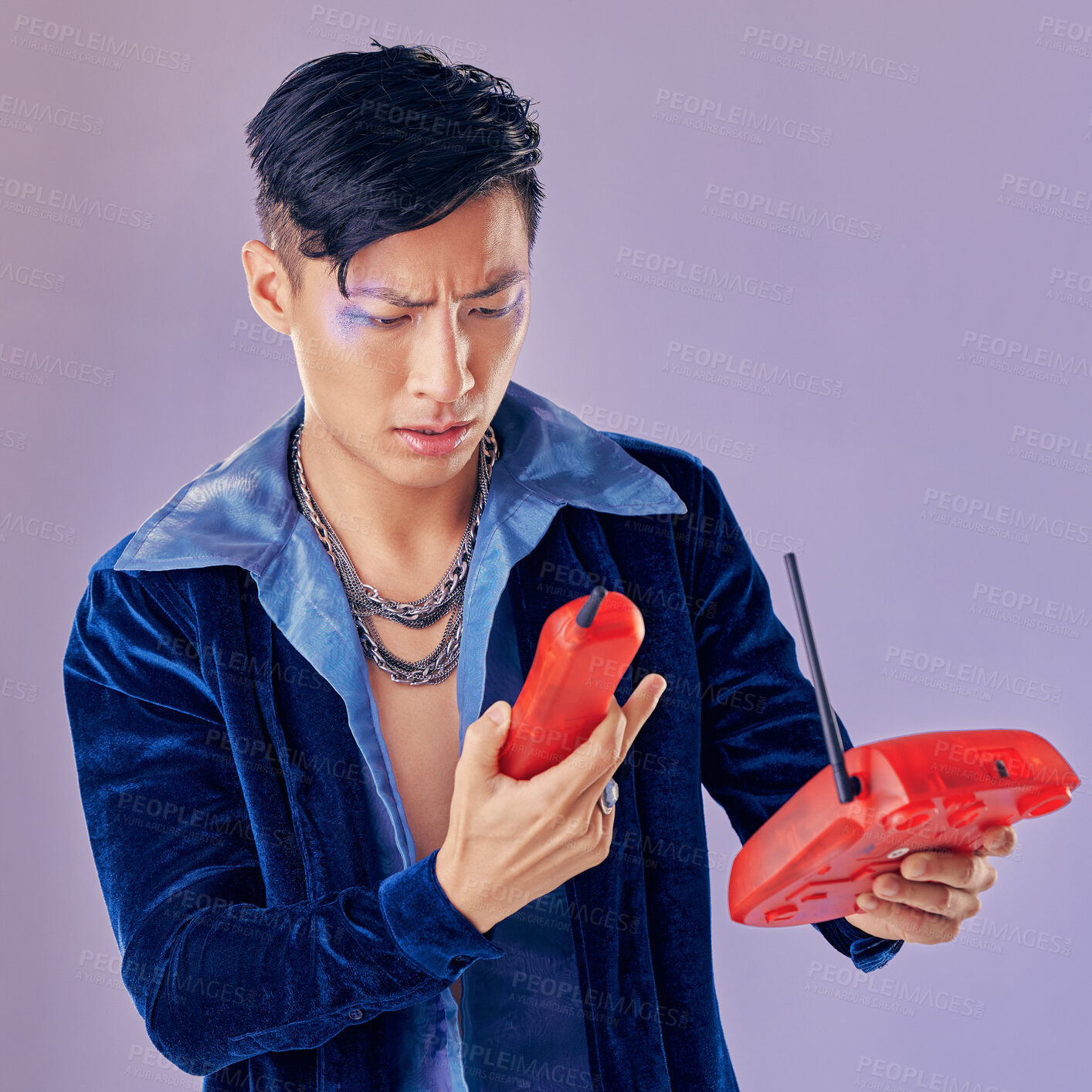 Buy stock photo Purple fashion, telephone and model confused with retro and vintage 1980s telecom device or phone call decline. Punk glitter design, eyeshadow sparkle and creative asian man with gen z beauty makeup