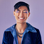 Fashion, color and man in studio for punk, retro and pop art style while feeling happy with makeup and vintage clothes on a purple background. Lgbtq, gen z and asian aesthetic model with makeup