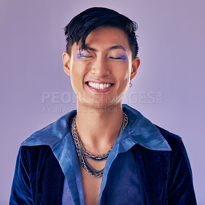 Buy stock photo Fashion, color and man in studio for punk, retro and pop art style while feeling happy with makeup and vintage clothes on a purple background. Lgbtq, gen z and asian aesthetic model with makeup