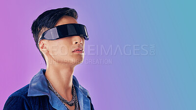Buy stock photo Beauty, fashion and man with cyberpunk glasses in studio with blue and purple background. Creative, cosmetics and young male model with visor for futuristic style, techno and designer clothing