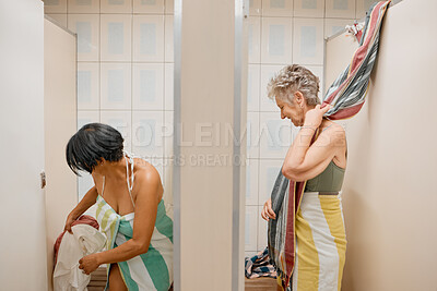 Buy stock photo Bathroom, summer and swimwear with a senior woman friends getting ready in a changing room while on holiday. Travel, retirement and locker room with a mature female and friend enjoying a vacation