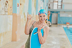Senior, sport and portrait of swimmer with rock hand at retirement home pool with energetic smile. Wellness, happy and vitality of elderly woman excited for swimming fitness, exercise and fun.