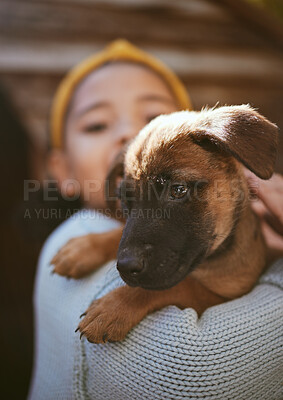 Buy stock photo Dog, playing and child at a shelter for adoption, love and care with a pet in nature. German shepherd, happy and girl holding a young puppy at a park to play, fun and relax with bokeh background