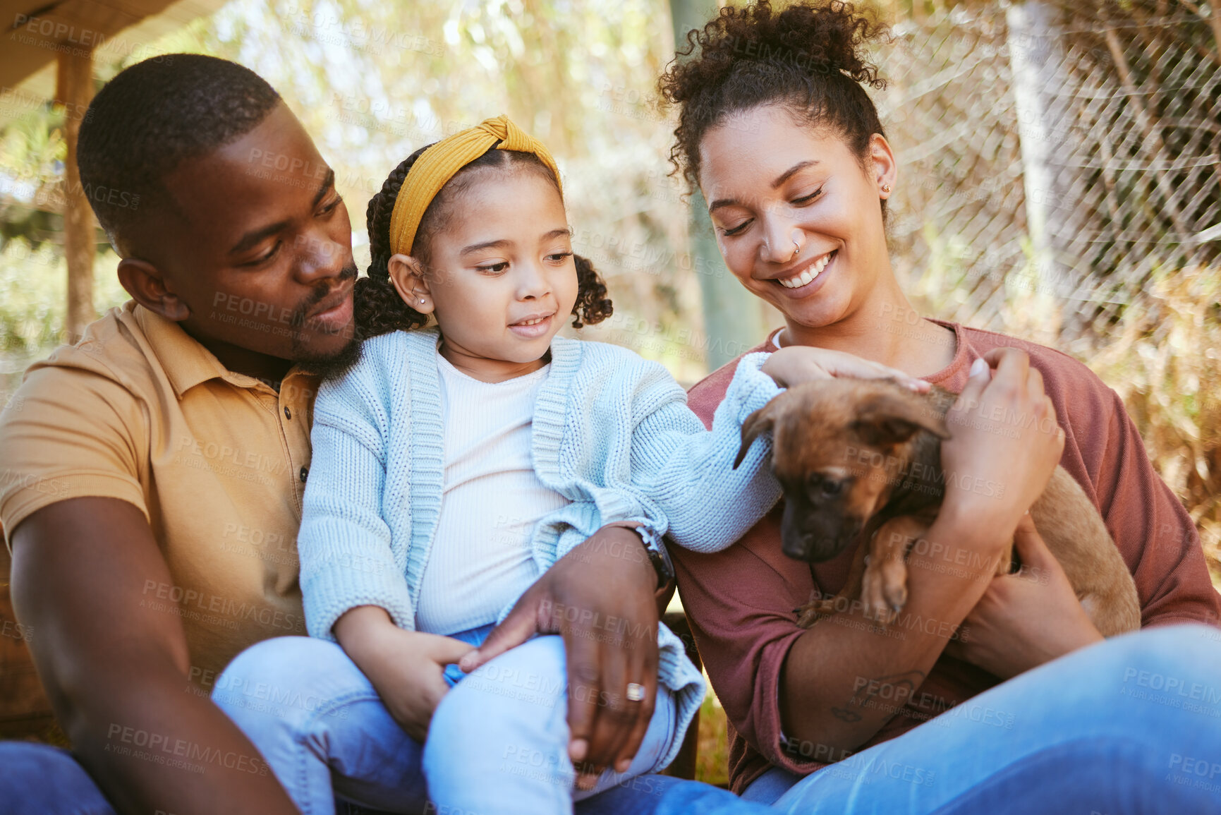 Buy stock photo Happy family, animal shelter and dog with girl and parents bond, relax and sharing moment of love, trust and care. Black family, animal rescue and puppy with family at shelter, playful, cute and joy