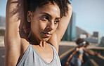 Fitness, city and woman doing a stretching exercise before an outdoor workout with motivation. Sports, training and healthy lady athlete doing an arm warm up outside in an urban town in Mexico. 