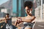 Fitness, black woman and sports watch to check progress, heart health and cardio running time while outdoor in city for health and wellness. African athlete with smartwatch for exercise and workout