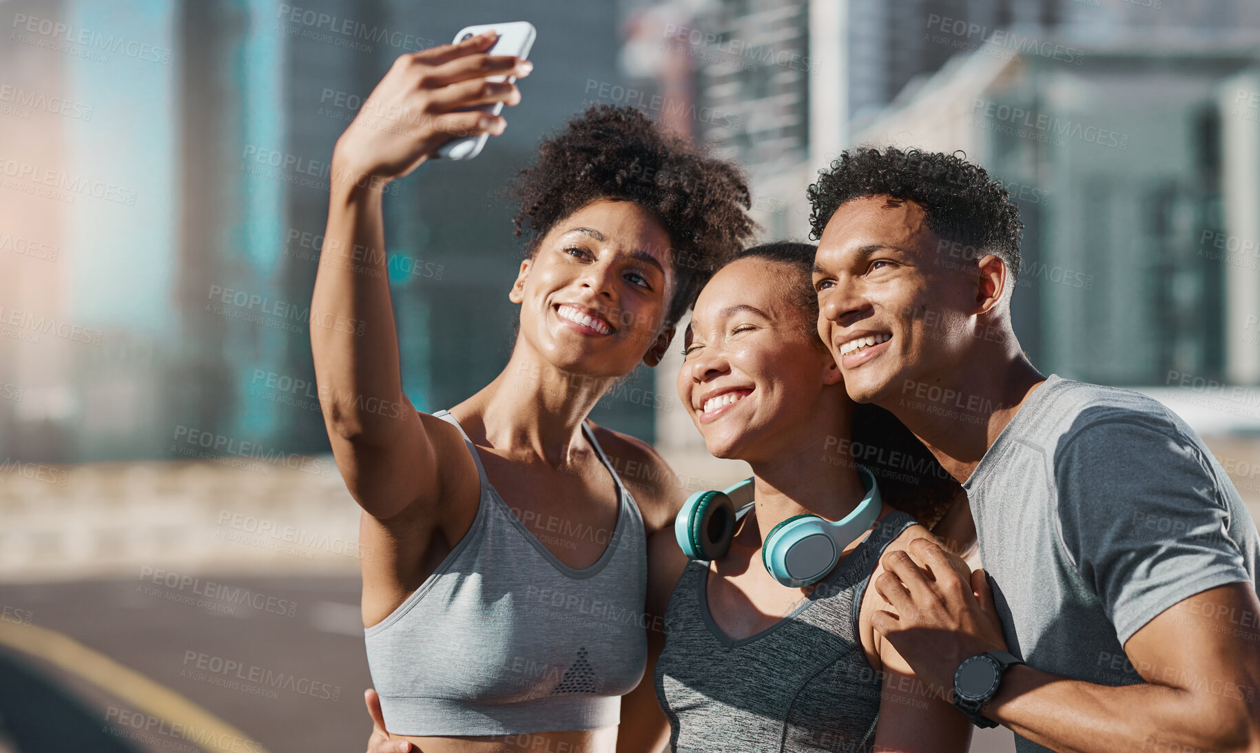 Buy stock photo Phone, selfie and fitness with a man and woman sports group taking a photograph together in the city. Health, teamwork and mobile with an athlete group posing for a picture in an urban town 