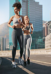 Fitness, exercise and friends running in the city together for an intense cardio workout in street. Sports, athletes and women runners doing outdoor training for marathon or competition in urban town