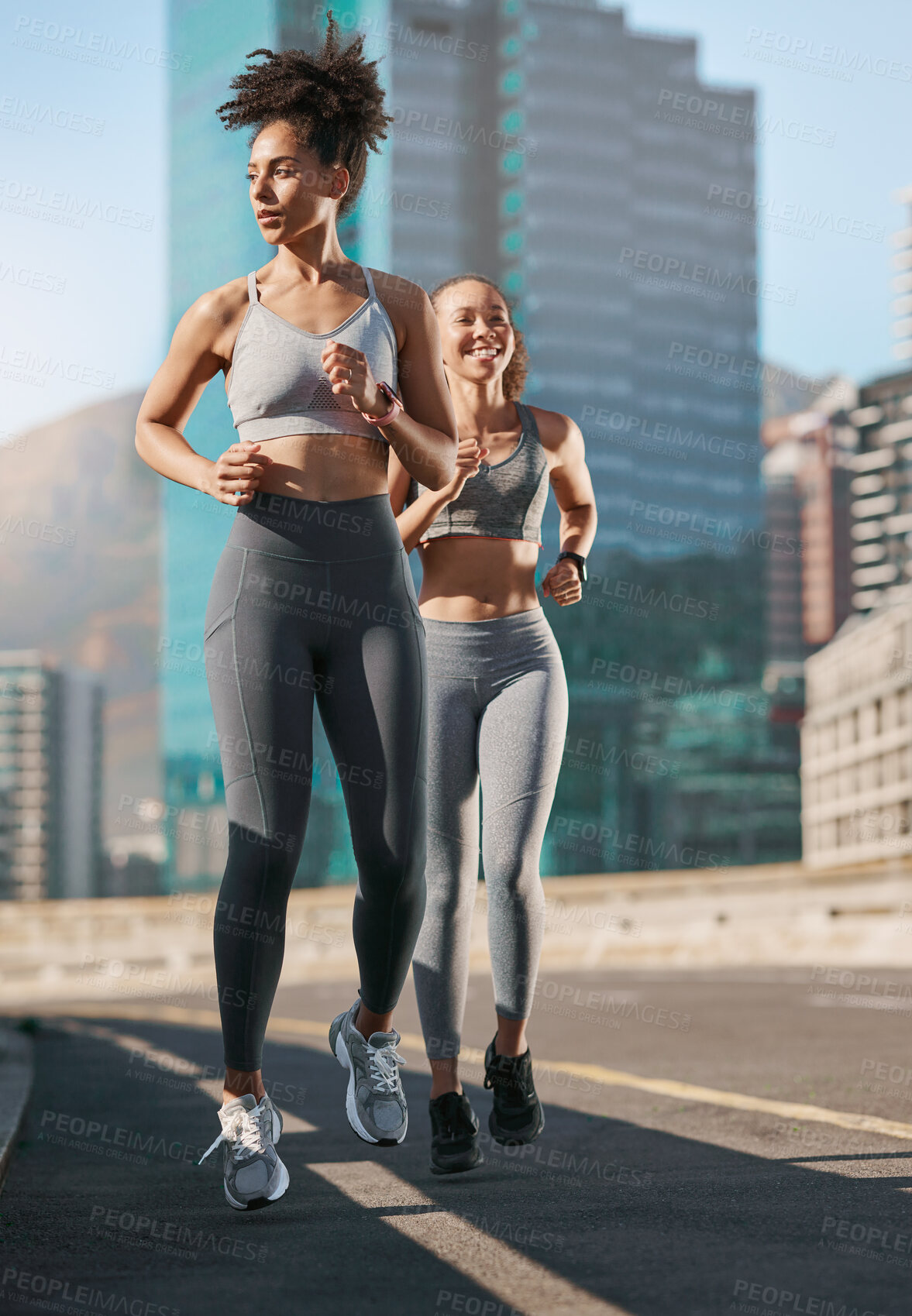 Buy stock photo Fitness, exercise and friends running in the city together for an intense cardio workout in street. Sports, athletes and women runners doing outdoor training for marathon or competition in urban town