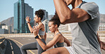 Fitness, exercise and stretching with friends in the city for workout or training. Sports, health or wellness with women and man friend exercising, warmup and workout for health or wellness in town 
