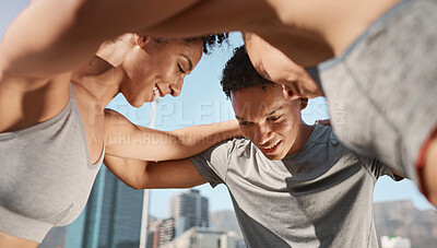 Buy stock photo Fitness, group and friends in a huddle before a workout together on a rooftop in an urban city. Sports, training and happy people doing an outdoor exercise for health, strength and wellness in a town