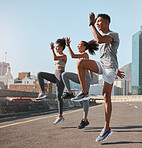 Exercise, friends and jump training in city for health, wellness and fitness. Sports, people and teamwork of runner group in street exercising, workout and jumping practice outdoors on urban road.
