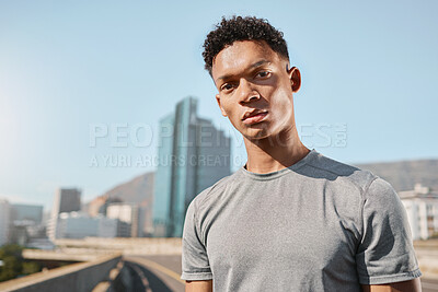 Buy stock photo Young black man and portrait on bridge with buildings, sky and city for running. Man, fitness and workout in urban, metro or town in summer sunshine on street with vision, dream or goal