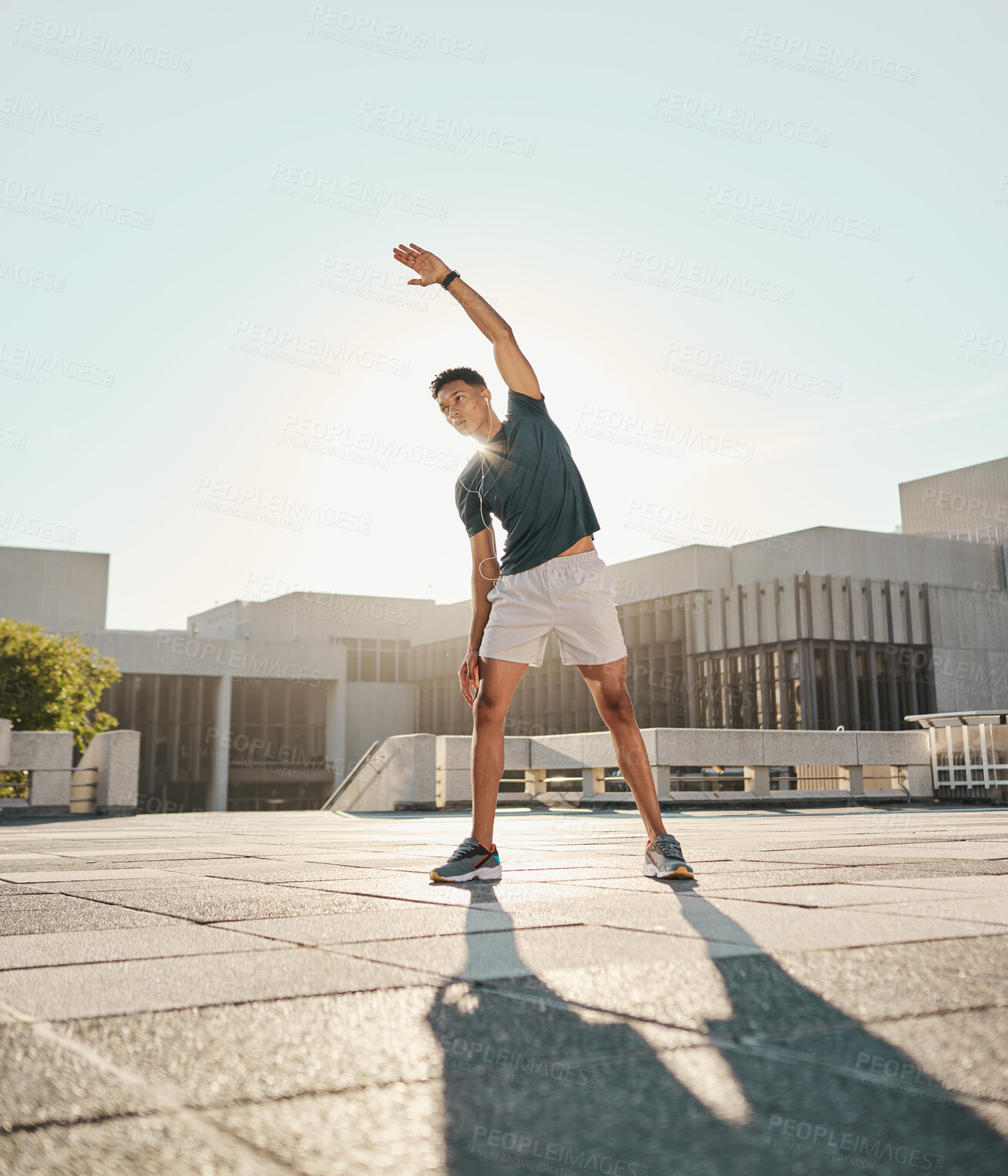 Buy stock photo Fitness, man and stretching arm in the city for warm up exercise, training or cardio workout in the outdoors. Active male in morning stretch for sports activity, performance or exercising in the town