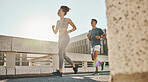 Fitness, couple and running workout in city, urban town and sunshine for exercise, healthy lifestyle and wellness. Young man, woman and runner partner with motivation of cardio, marathon and training