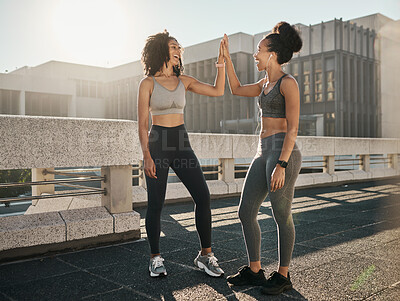 Buy stock photo Fitness, friends and high five in the city for workout, exercise or healthy training together in the outdoors. Happy women touching hands in partnership for sports wellness, exercising or run in town