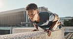 Exercise, man and push ups outdoor for workout, fitness and focus for wellness, health and training. Motivation, young male and athlete in city, being healthy and practice in sportswear and strong.