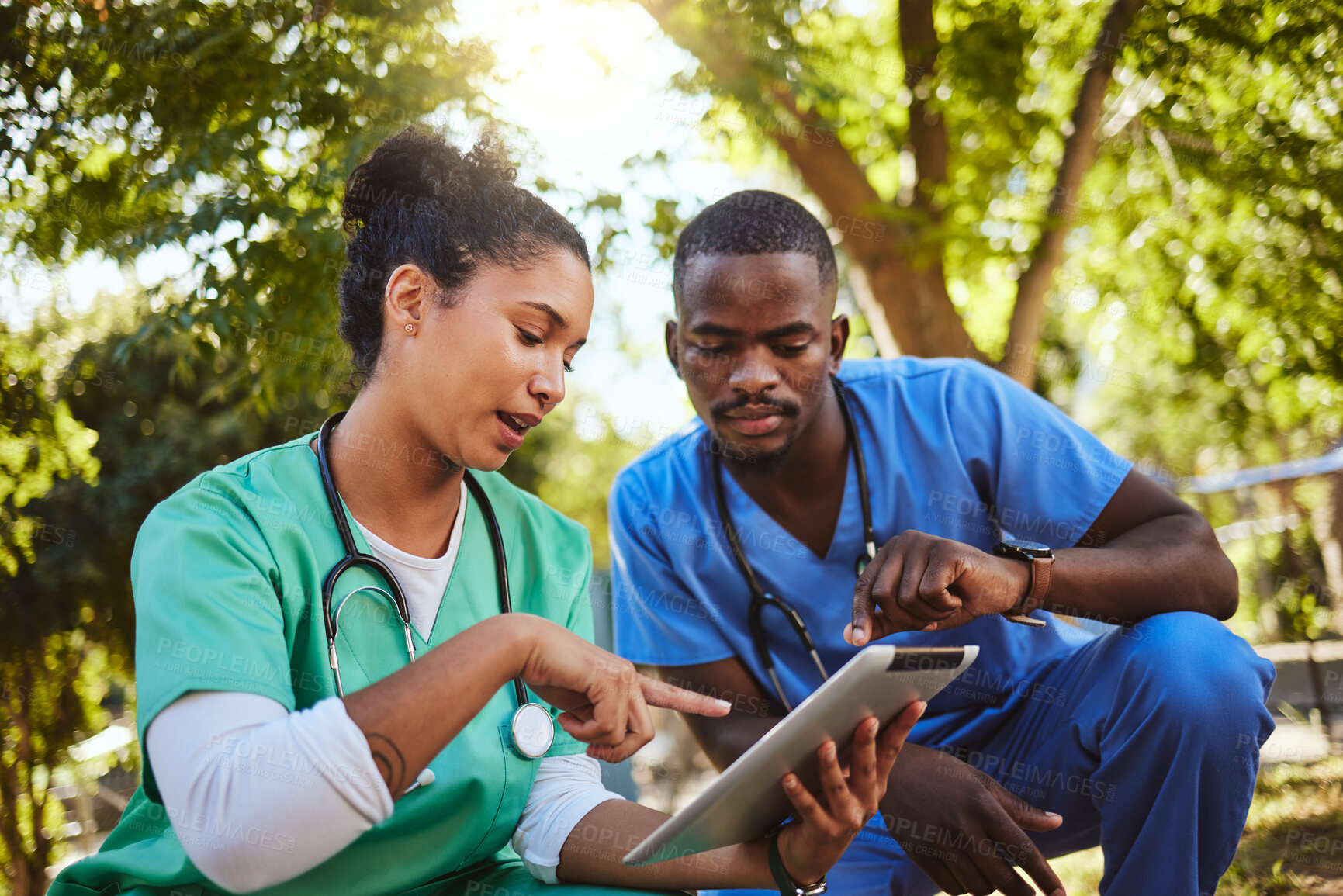 Buy stock photo Nurse, teamwork and doctors with a tablet in nature for medical research on natural healing medicine. Collaboration, development and healthcare employees talking and coworking on a digital report