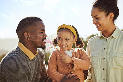 Buy stock photo Countryside, nature and happy black family with child enjoying weekend, holiday and vacation in summer. Love, family and girl playing with flower with father and mom with fun, freedom and happiness