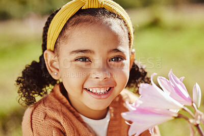 Buy stock photo Flower, happy and girl face in spring portrait with beautiful plant of outdoor in garden or park in summer. Young child enjoying sweet and natural scent of bright floral petals in backyard with smile