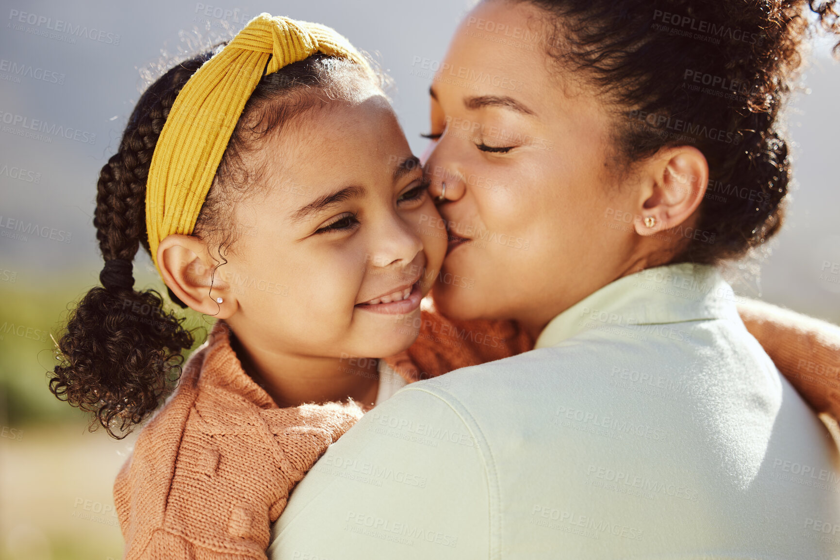 Buy stock photo Love, family and mother and girl kiss in a park, happy and relax while bonding and embracing in nature. Happy family, kissing and mama with daughter on a trip in a forest, loving and caring in Mexico