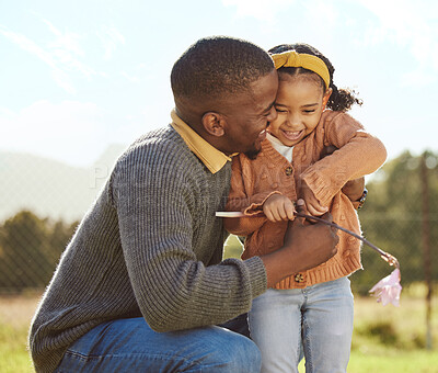 Buy stock photo Black man hug girl kid in park, garden and grass field outdoors for love, care and quality time together on fathers day. Happy dad, excited child and black family picking spring flowers in sunshine 